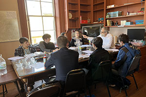 The instructor leads class in the study of high school biology