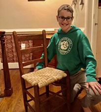 A student completes caning project.