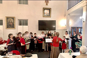 The instructor leads students in the fundamentals of sacred music